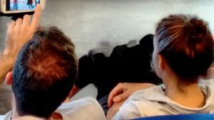 the back of two adult heads talking