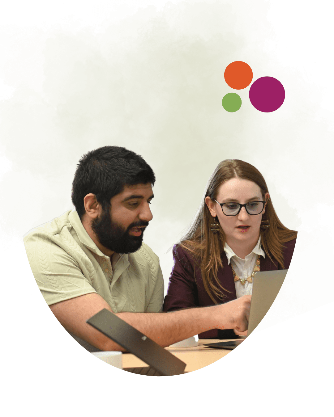 2 people collaborating over a laptop