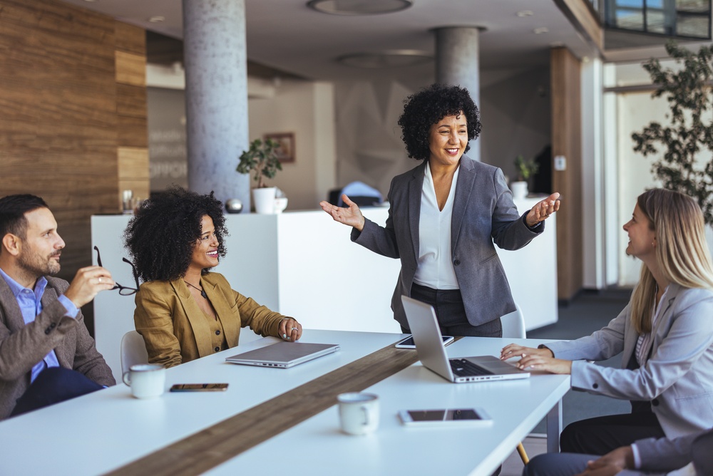 Association leaders reviewing member engagement strategies together around a conference table