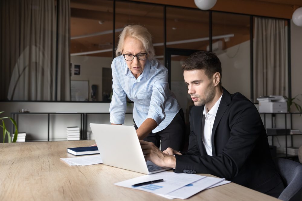 Two association members connecting at a cohort kickoff built on a strong mentoring program structure
